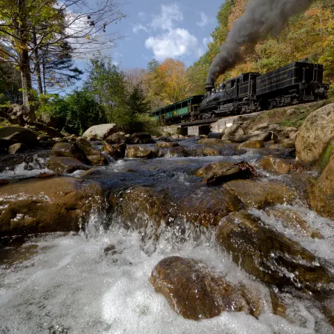 a large waterfall over a river
