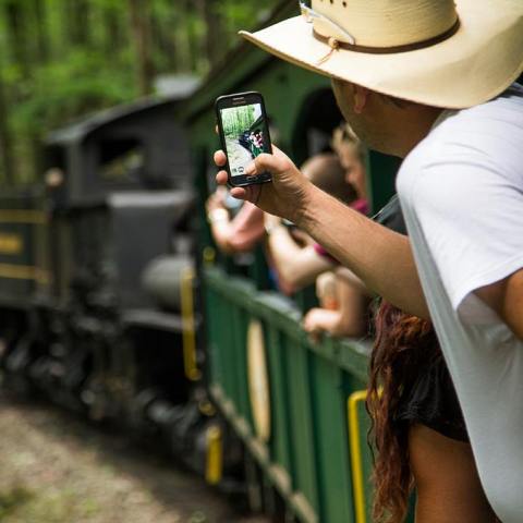 a person riding on the back of a train