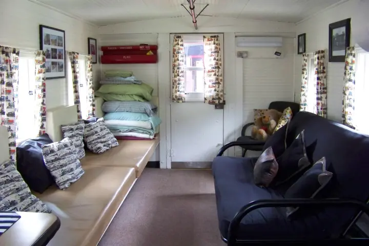 a living room filled with furniture and a flat screen tv