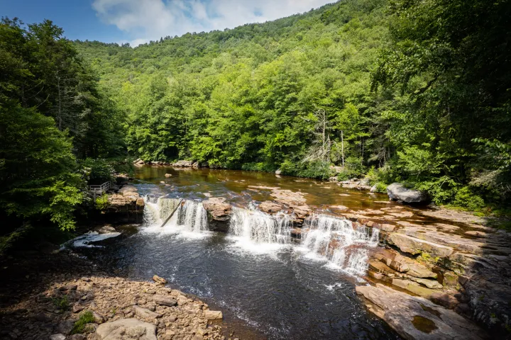 a large waterfall over a body of water