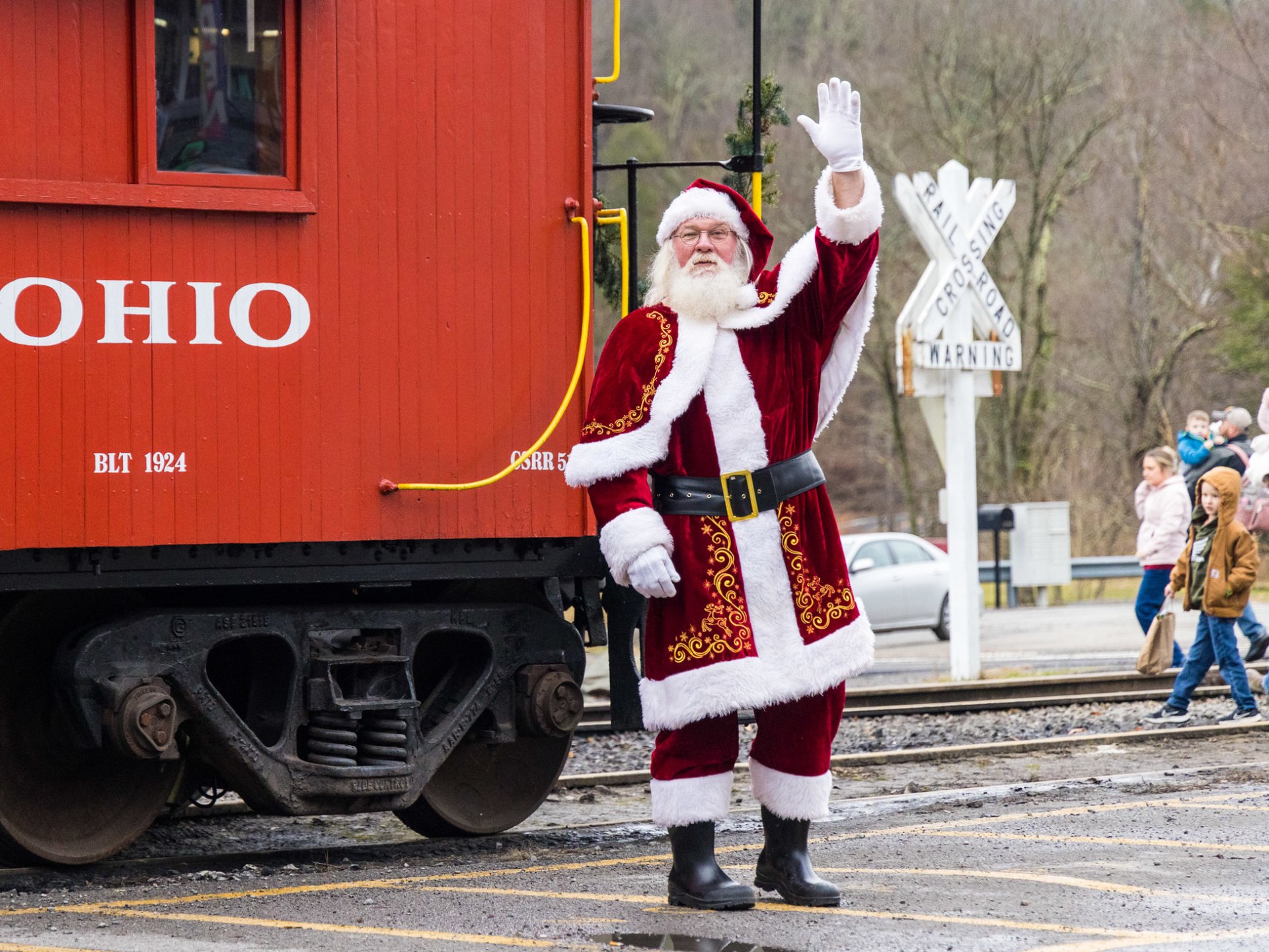 a person standing in front of a train