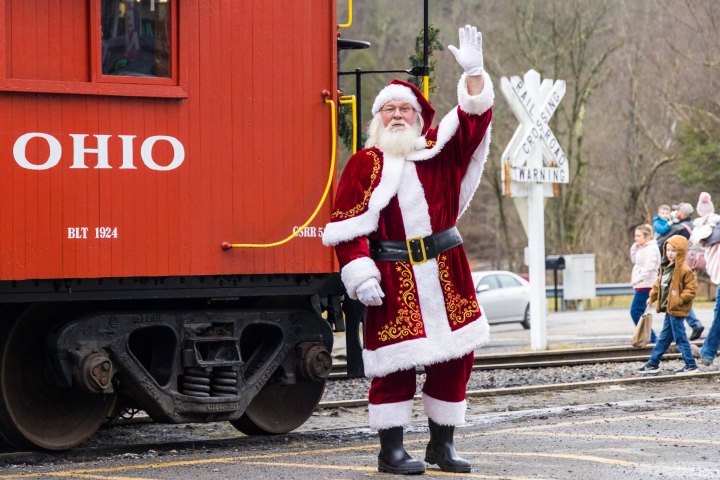 a person standing in front of a train