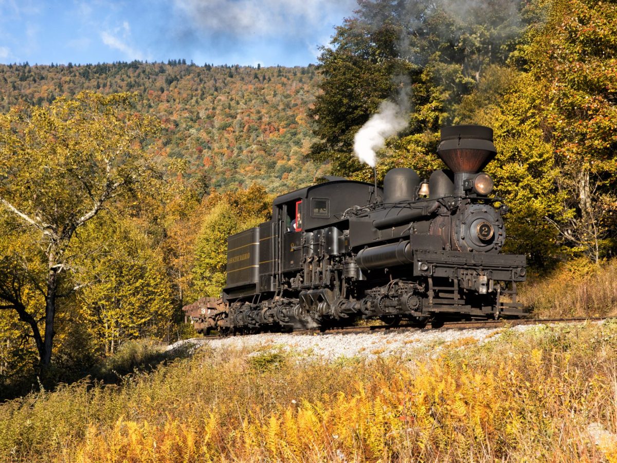 Shay 2 content1 a train on a track with smoke coming out of it