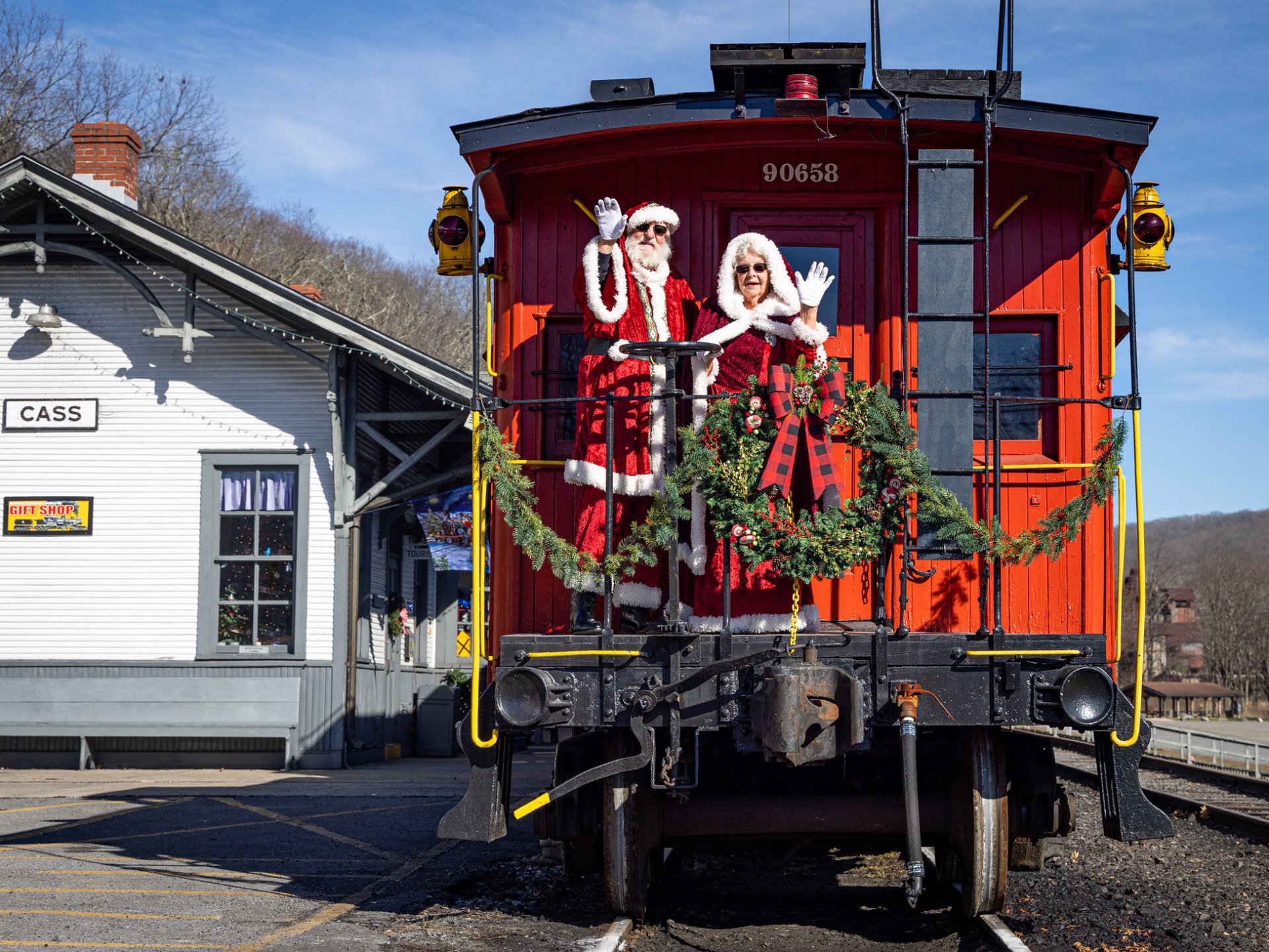 a train is parked on the side of a building