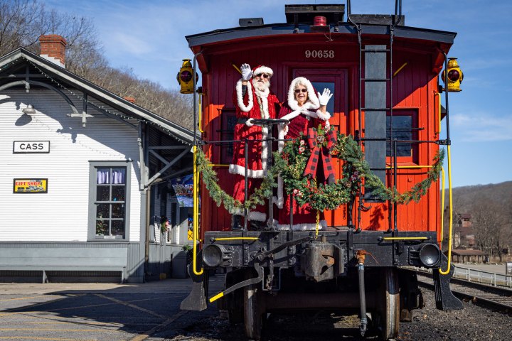 a train is parked on the side of a building