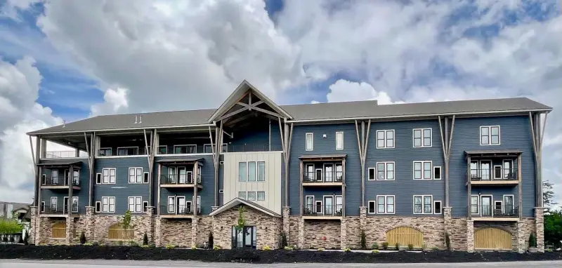 a house that is parked on the side of a building