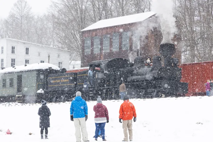 a group of people that are standing in the snow