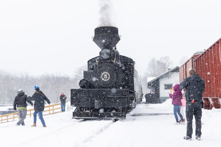 a group of people walking in the snow