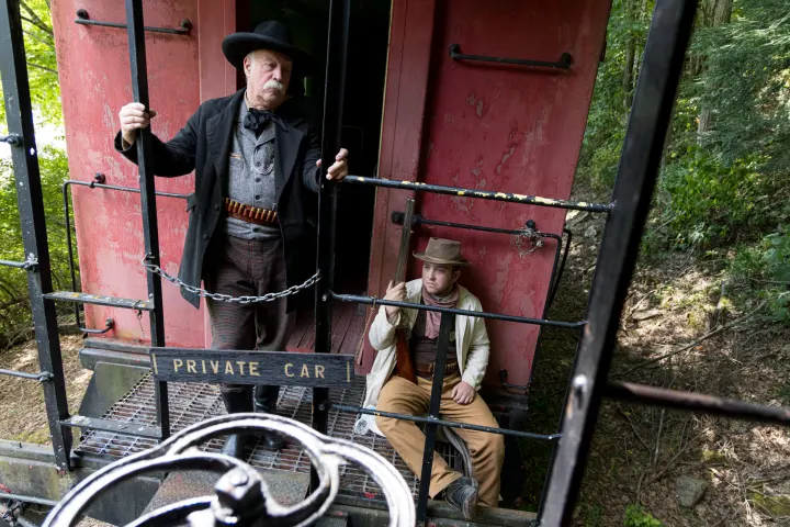 a person standing next to a bicycle