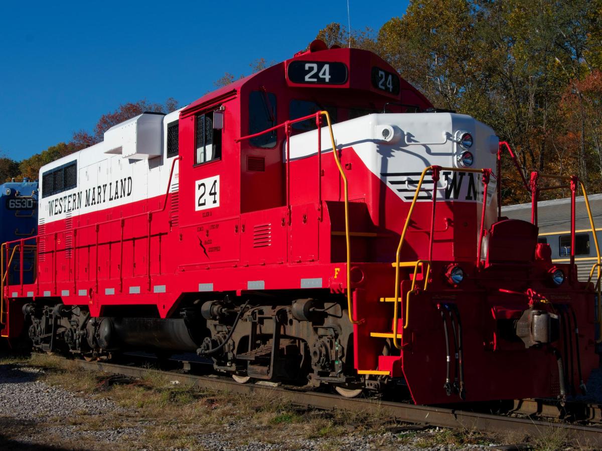 Red diesel locomotive with 'Western Maryland' text on the side.